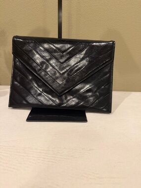 Yves Saint Laurent black chevron quilted leather envelope clutch bag.